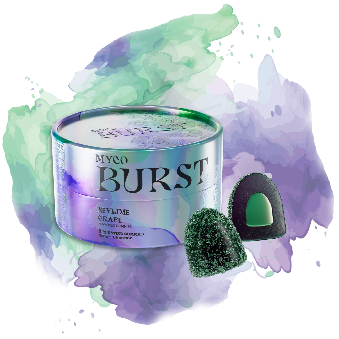 MycoBurst Key Lime Grape flavored mushroom gummies in a shiny iridescent tin, shown with one whole gummy and one sliced open to reveal a green bursting center, set against a watercolor splash of green and purple tones.
